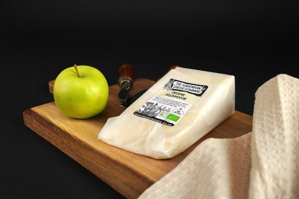 Award winning Trusmadoor cheese on a chees board, made by the Torpenhow Cheese Company